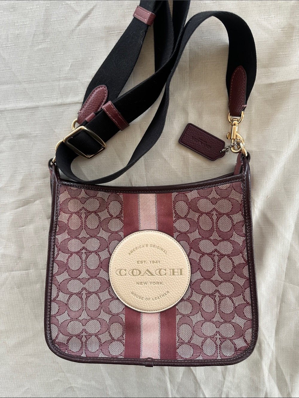 Coach Dempsey File bag in signature jacquard wine color